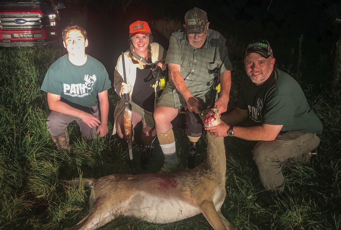 Veteran Jim Fellows holds up the head of an adult doe taken in Centerville Township during the Liberty Hunt. He is accompanied, from left, by guide Cody Campbell, recreational therapist Samantha Mahon, and his son, Steve Fellows. They were hunting courtesy of cherry farmer Greg Williams. C...