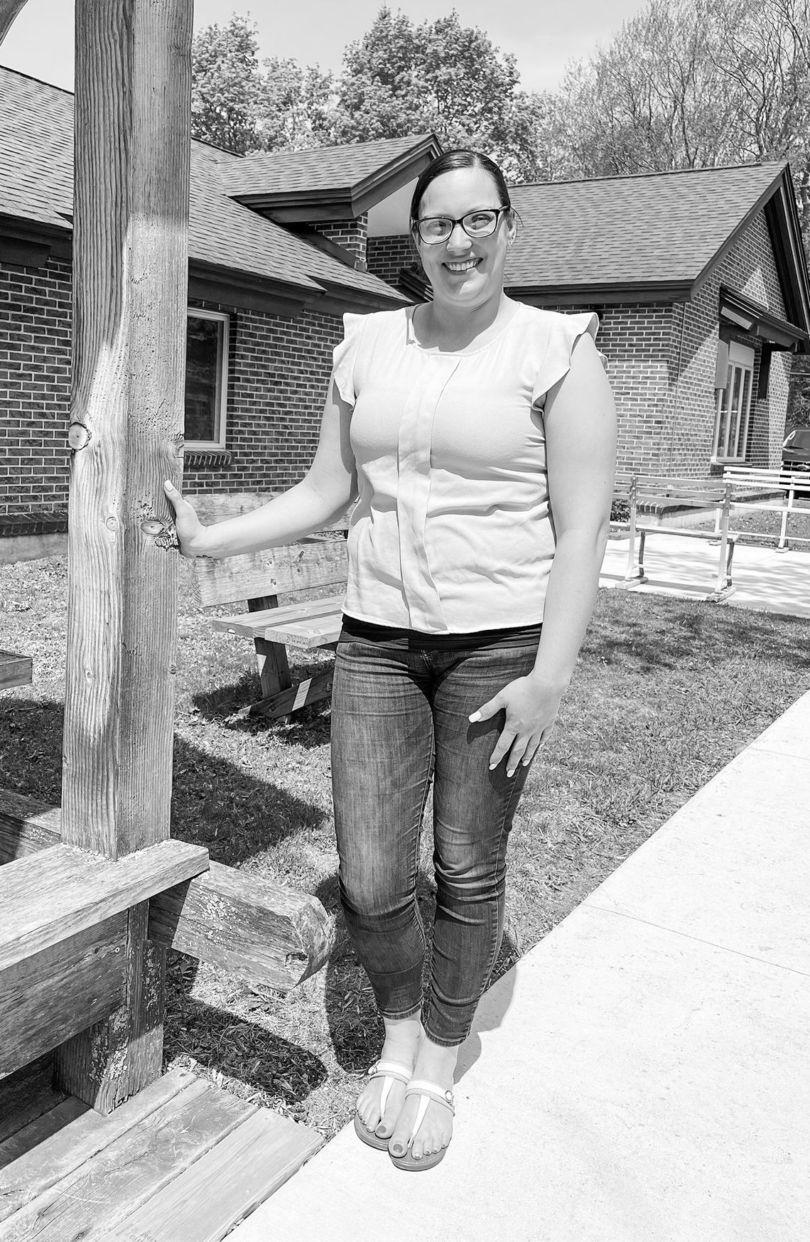 Jessica Wilson, who currently serves as the Leelanau Township clerk, is pictured in front the township hall on Monday afternoon. Enterprise photo by Meakalia Previch-Liu