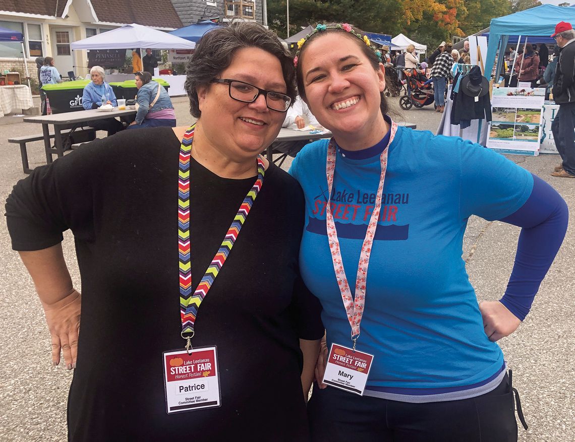 Co-chairs Patrice Korson, left, and Mary Lingaur had instrumental parts in the continuation of the Lake Leelanau Street Fair, which is estimated to have brought up to 2,000 people to the community. Enterprise photo by Alan Campbell