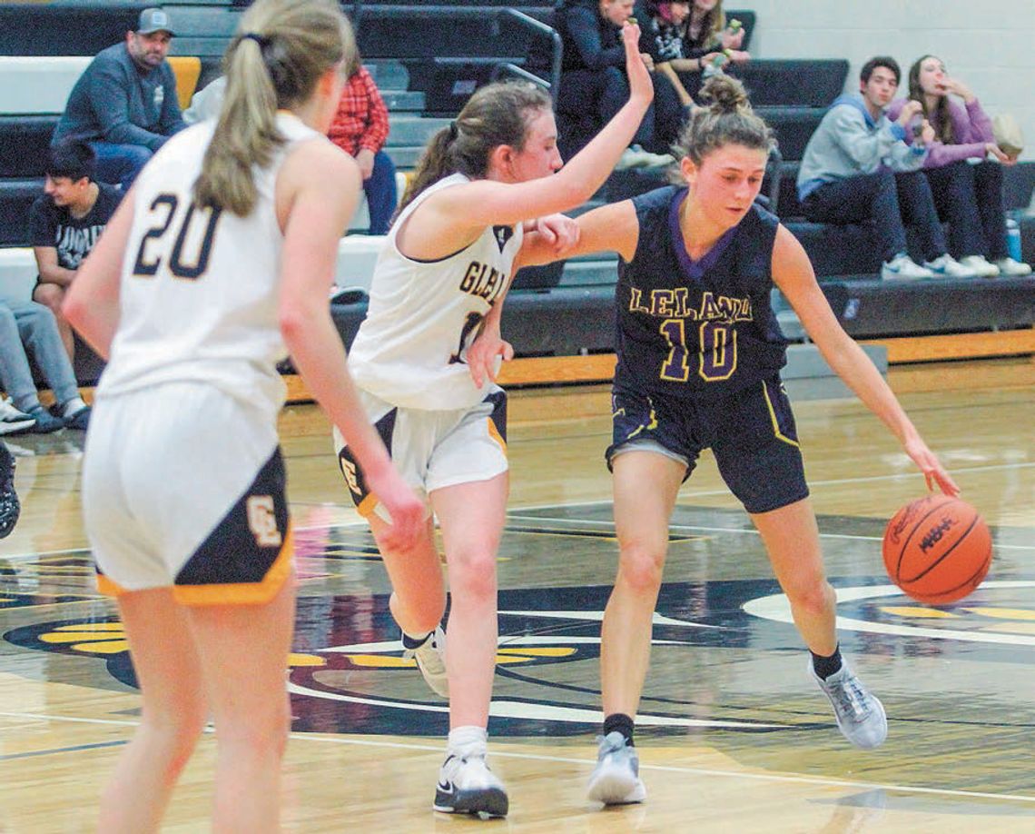Leland junior Ella Knudsen gets the Comets in offensive formation while being pressured by Laker guard Hailey Anderson. Enterprise photo by Brian Freiberger