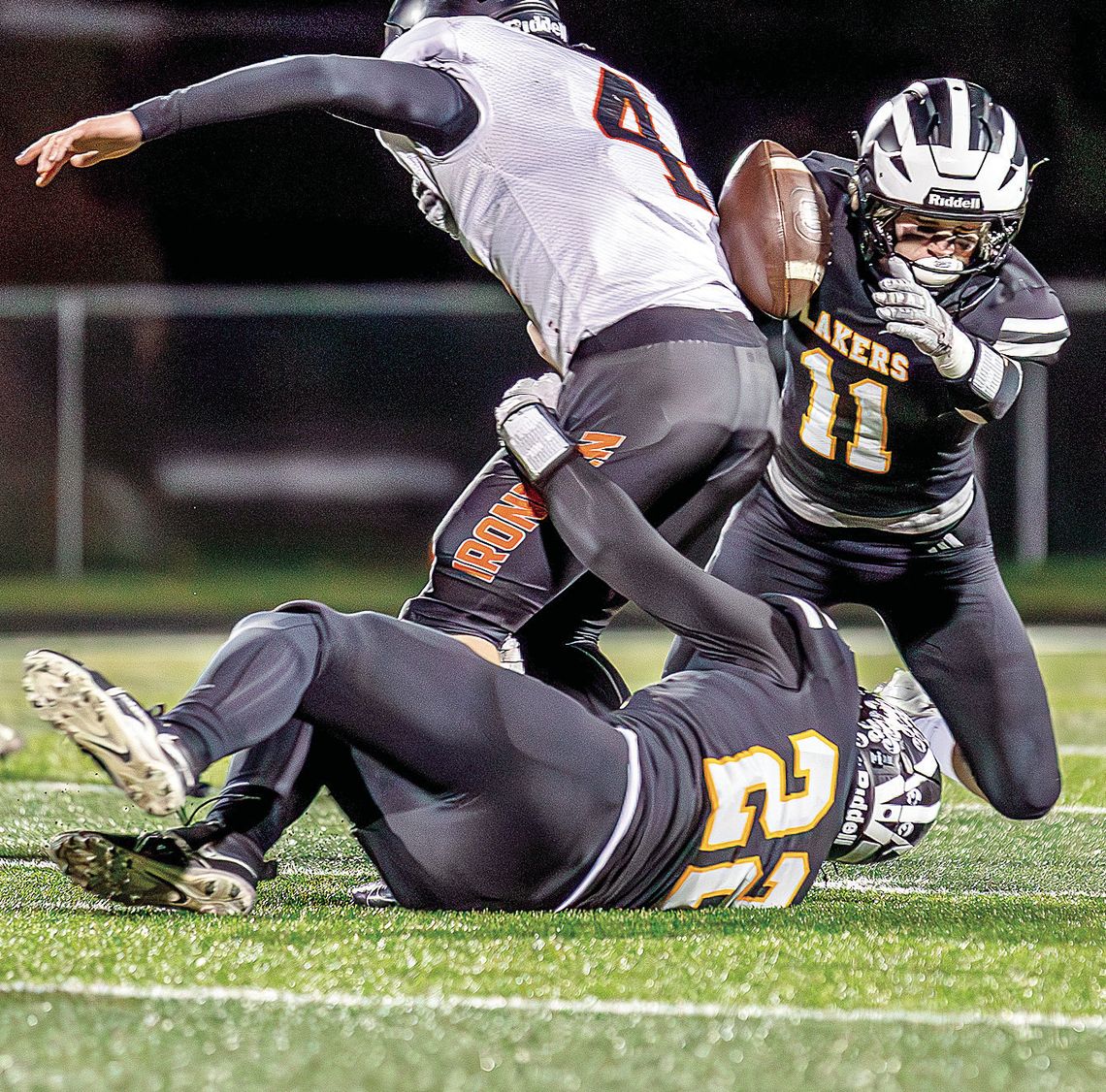 The swarming Glen Lake defense forced a fumble during a 38-14 win over Mancelona in the first round of the MHSAA football playoffs. Sam Dykstra (right) and Peter Gelsinger (left) Photo courtesy of Meridith McNabb