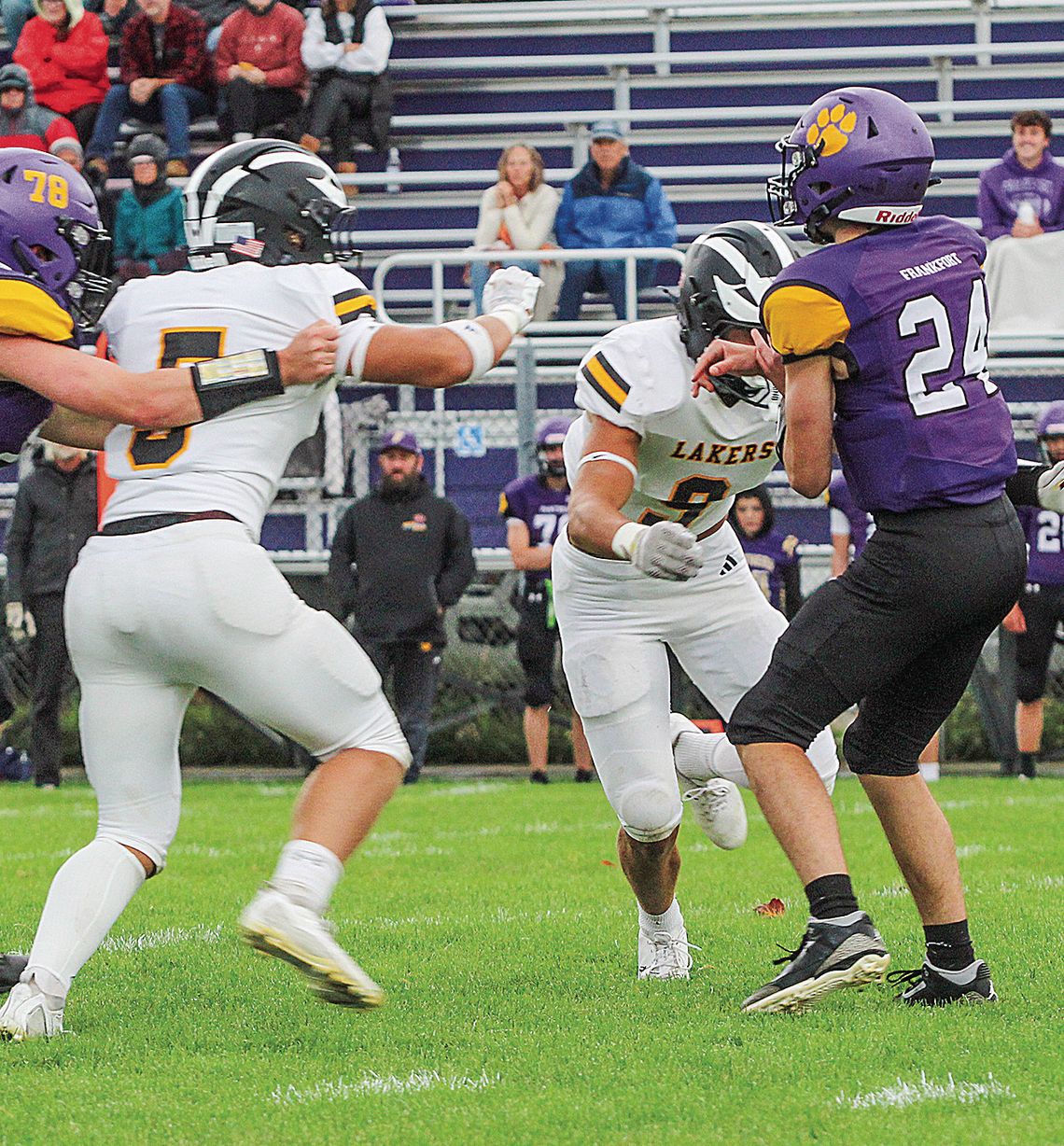 Glen Lake defender Benji Allen (right) and Fletcher Middleton pressure Frankfort quarterback Carter Kerby on Friday.