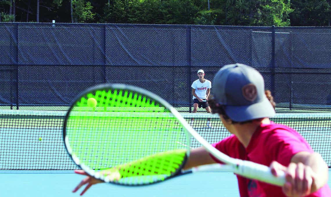 Glen Lake sophomore Hathorne Sutherland volleys a serve from junior Ben Selby at practice earlier this week. Enterprise photo by Brian Freiberger