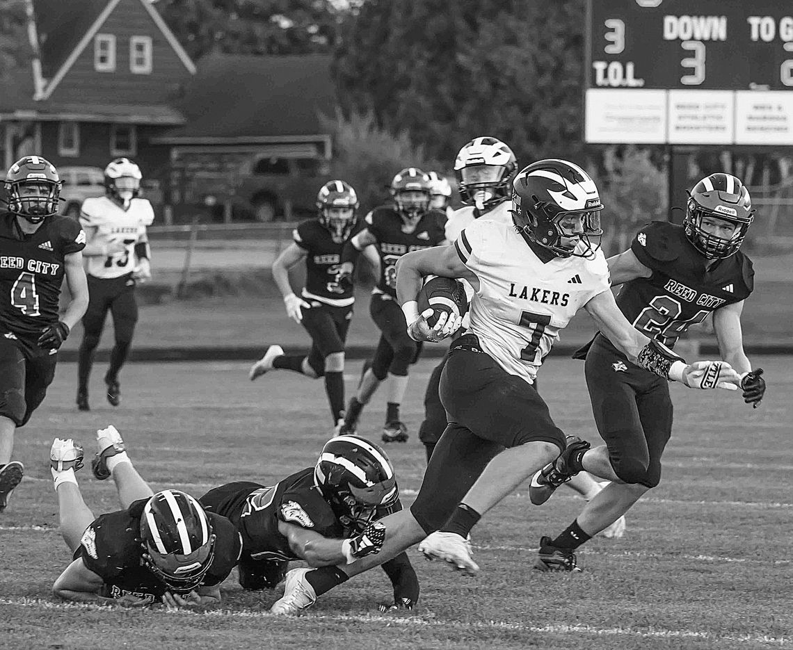 Glen Lake senior Boden Fisher breaks a tackle against Reed City on Friday. The Lakers will travel to East Jordan Friday at 7 p.m.