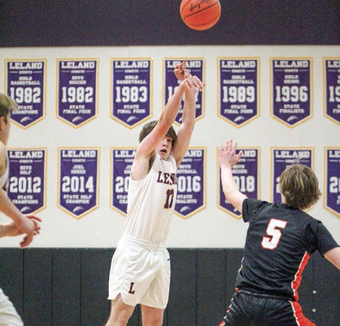 Enterprise photos by Brian Freiberger Leland guard Brady Keen attempts a 3-point shot against Kingsley during a 57-45 loss on Tuesday.
