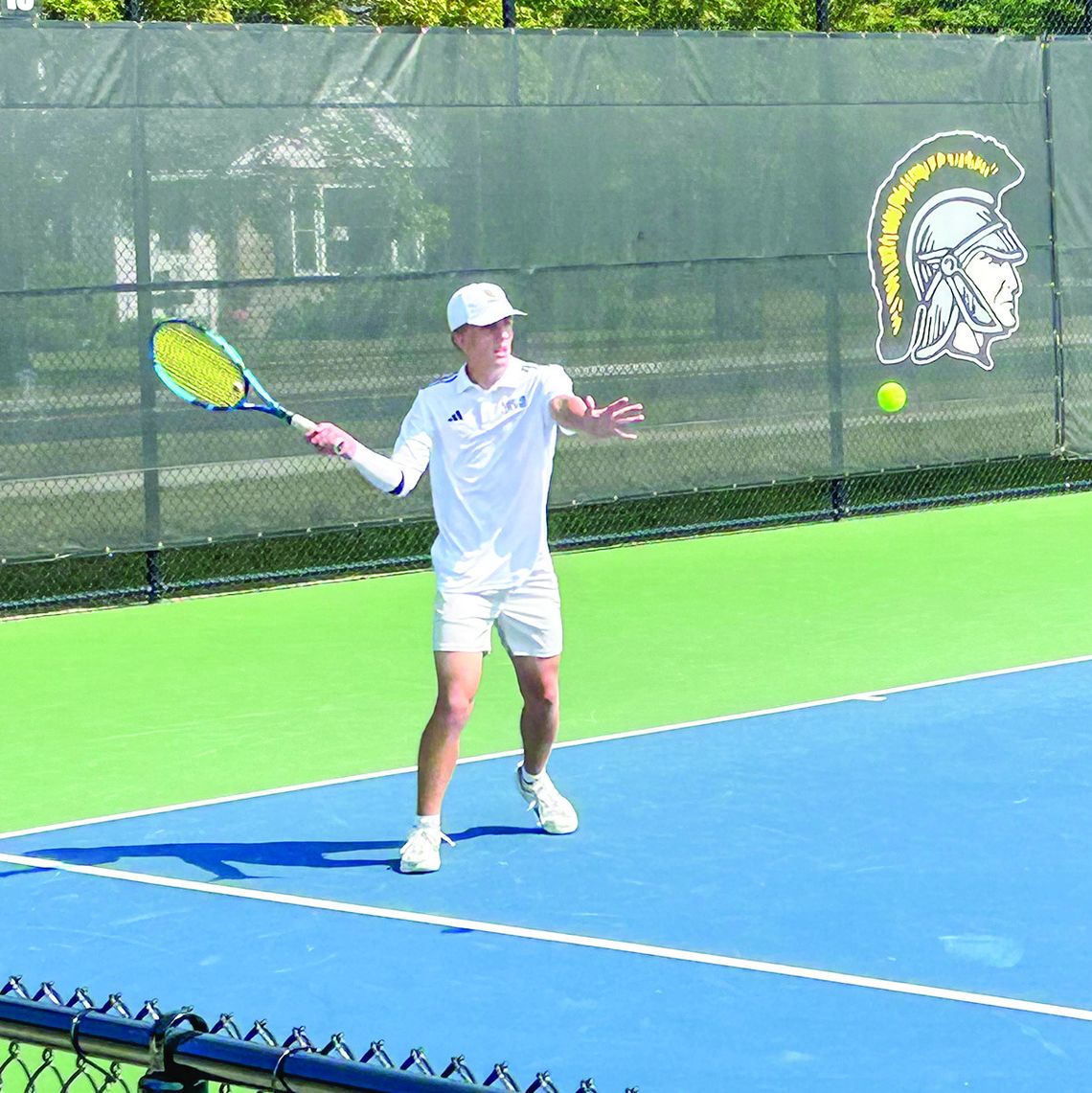 Glen Lake senior Ben Romzak returns a serve during a match against TC Central earlier this fall. Courtesy photo