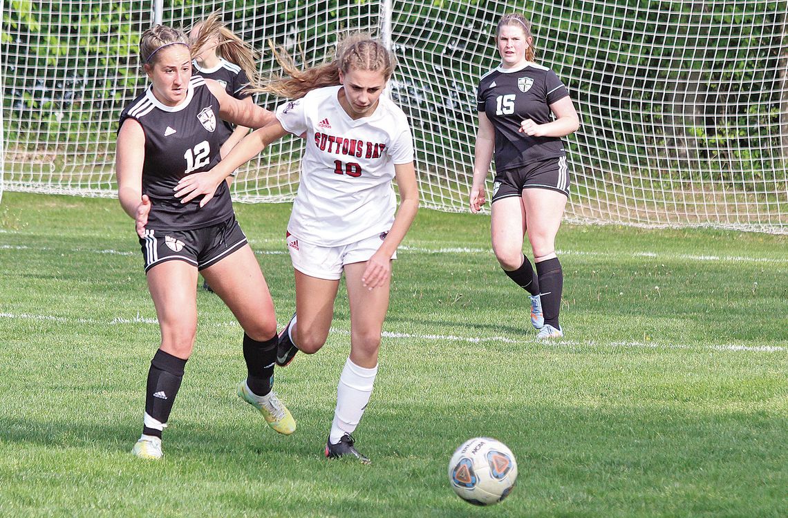 Glen Lake senior Paige Steffke and Suttons Bay sophomore Megan U’Ren battle for possession during a Northwest Conference soccer game in 2023. Enterprise photo by Brian Freiberger