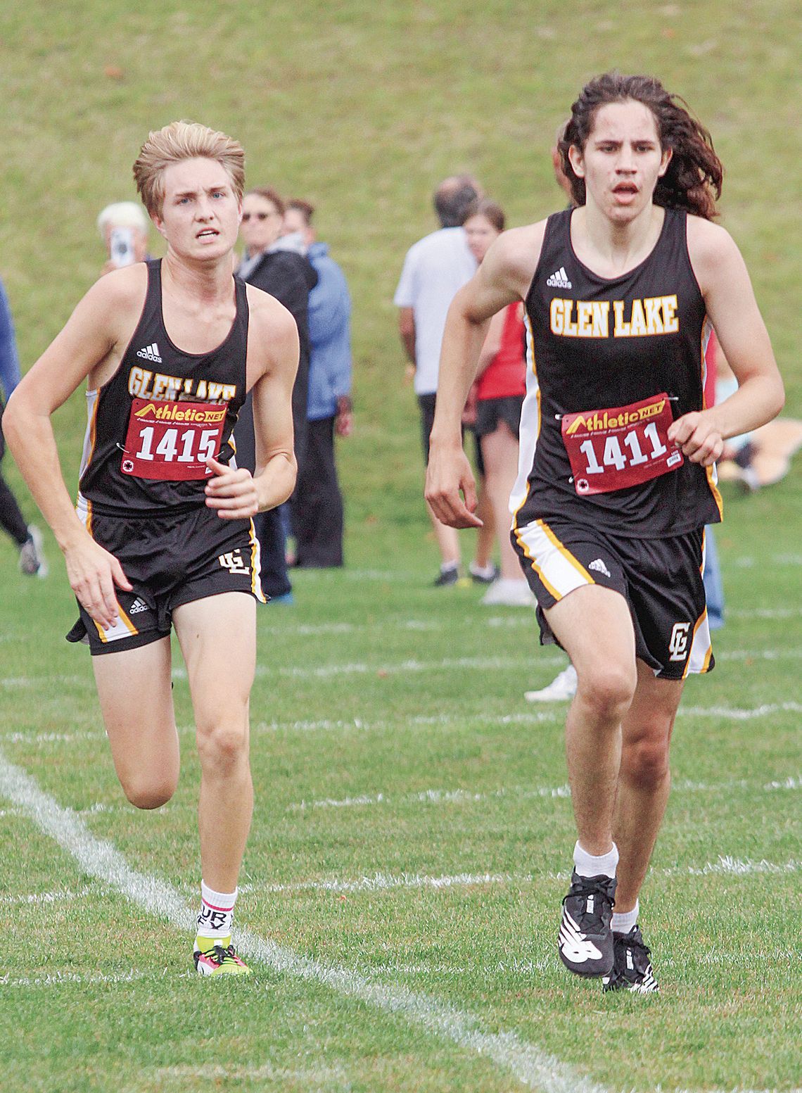 Glen Lake sophomore Britton Wheeler and junior Dexter Martin compete during a home meet Tuesday. Enterprise photo by Brian Freiberger