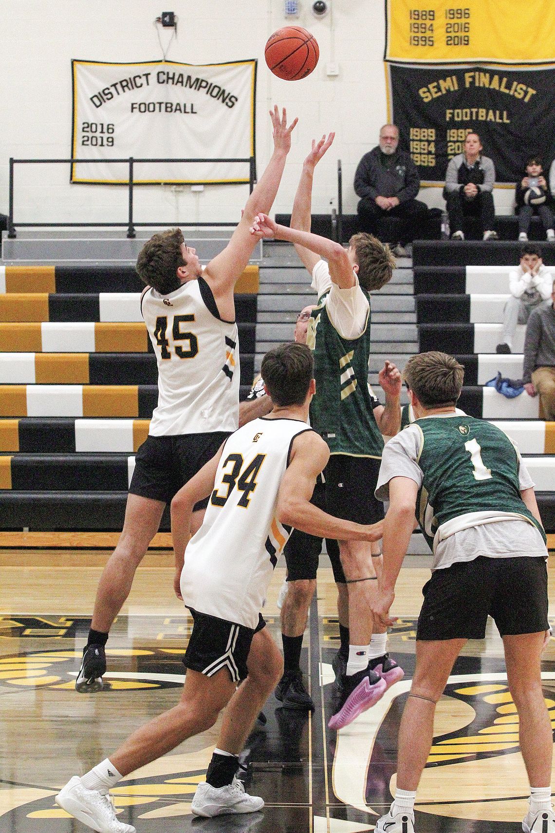 Glen Lake junior Jacob Plamondon tips off the season against TC West Tuesday during a scrimmage. Enterprise photo by Brian Freiberger