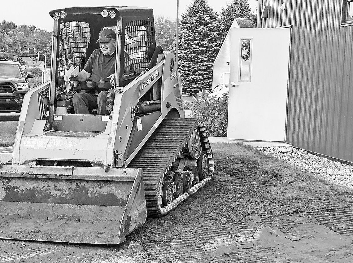 Dave Couturier of Lake Leelanau Excavation prepares the site of a small addition to the Leelanau Christian Neighbors building that, when completed, will house the nonprofit’s second walk-in freezer. Enterprise photo by Alan Campbell