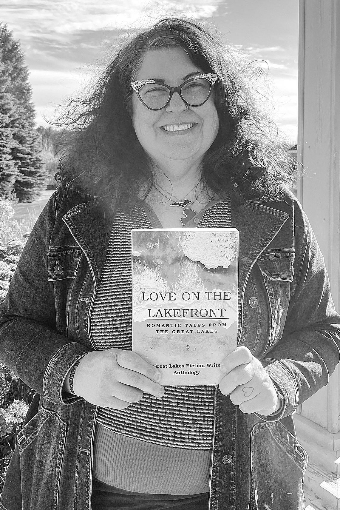 Lisa Rabey, a local author based out of Cedar, is one of the featured authors in the recently published anthology “Love on the Lakefront: Romantic Tales from the Great Lakes.” Enterprise photo by Meakalia Previch-Liu