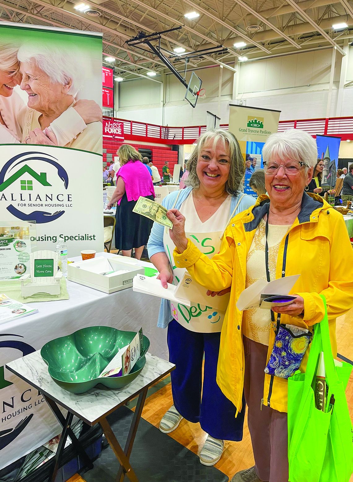 Leelanau resident Joy Anderson (right) won $20 at Connie Hintsala's (left) table on Tuesday afternoon at the senior expo