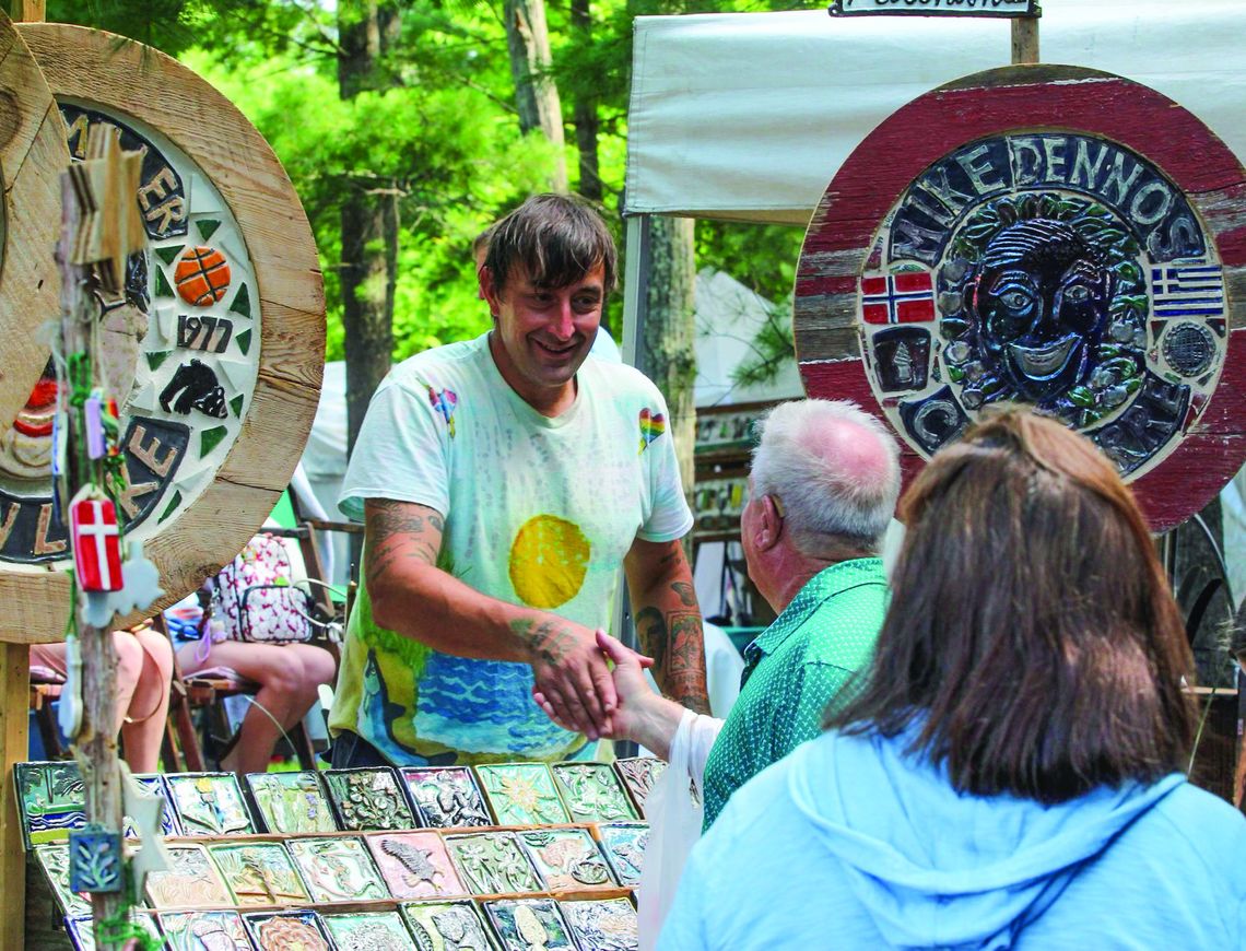 Leif Sporck Leif Sporck of Sporck Tileart was very busy yesterday at the Glen Lake Womens Club Art Fair. Enterprise photo by Brian Freiberger