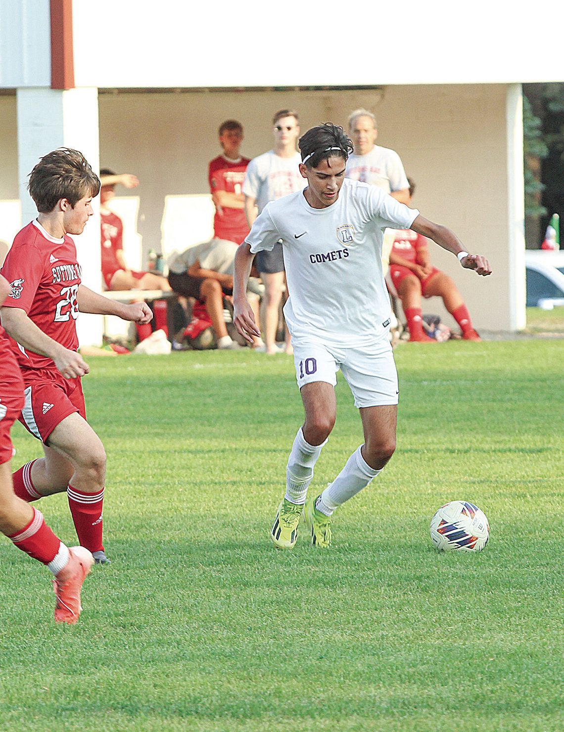 Leland sophomore Nano Creamer battle for possession during an 8-0 win over Suttons Bay last week. Enterprise photo by Brian Freiberger