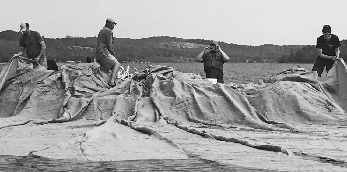 Large burlap blankets block sunlight to Eurasian watermilfoil (EWM), an invasive located in Lake Leelanau. Enterprise file photo