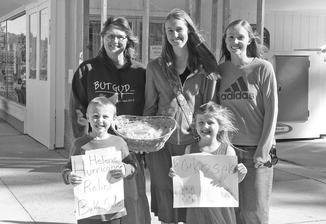 Barb Plamondon and her daughters Melissa Hapala and Casey Cholowinski, from left, held a bake sale Friday with grandchildren Aiden and Aurora. Enterprise photo by Brian Freiberger