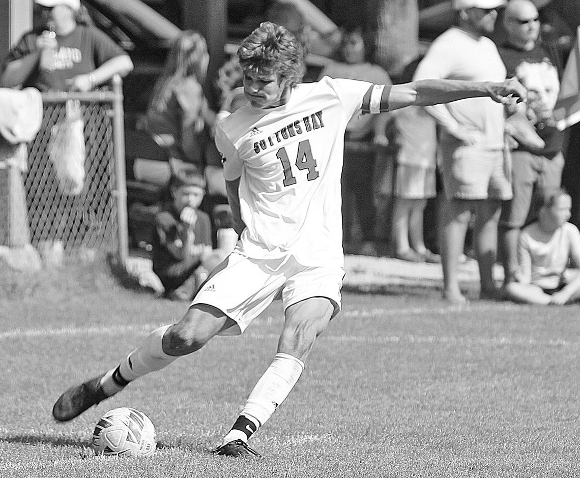 Suttons Bay senior Finn Mankowski drills a free kick against Leland in the fall of 2023. Mankowski will be heading to Costa Rica as he made the USMNT (U-19) soccer team. Enterprise photo by Brian Freiberger