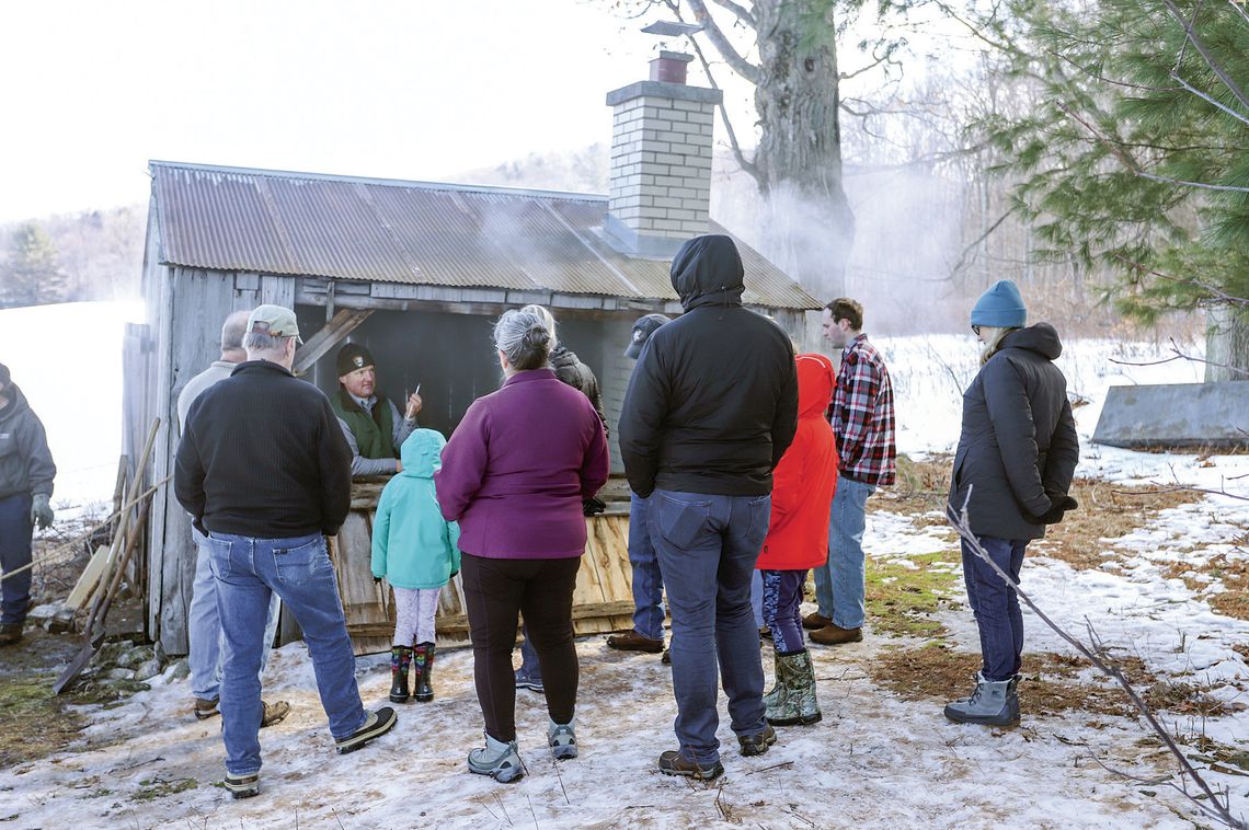 Ranger Matt explains the maple sugaring process while standing inside the sugar shack at Dechow farm. Photo courtesy of the National Park Service. Courtesy photo