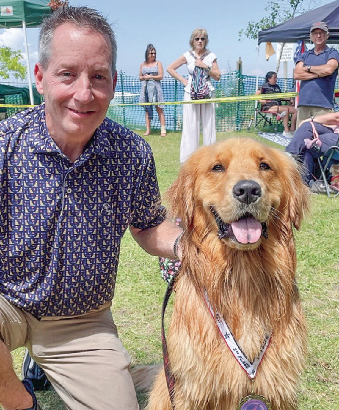 Jeff Rabidouz and his dog ‘Blu’ pose for a photo after ‘Blu’ finished third at the Ultimate Air Dog Competition during the Cherry Festival in Traverse City. Courtesy photo
