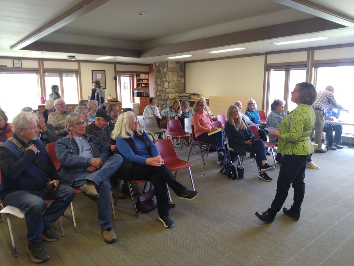 Kama Ross, Leelanau County’s District 5 commissioner and a member of the Leelanau Energy Futures Task Force, welcomes a roomful of event attendees to an Earth Day discussion panel at Leland Public Library. The event featured presentations from a part-time assistant professor at Wayne State...