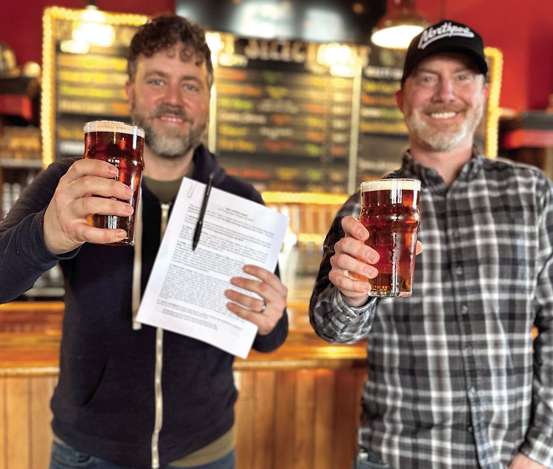 The Mitten Brewing Company owners Chris Andrus (at left) and Max Trierweiler (right) are pictured at their Northport location on Tuesday after securing a long-term lease with Three Rivers Properties. The five year lease with a five year renewal term helps ensure that The Mitten’s “up north...