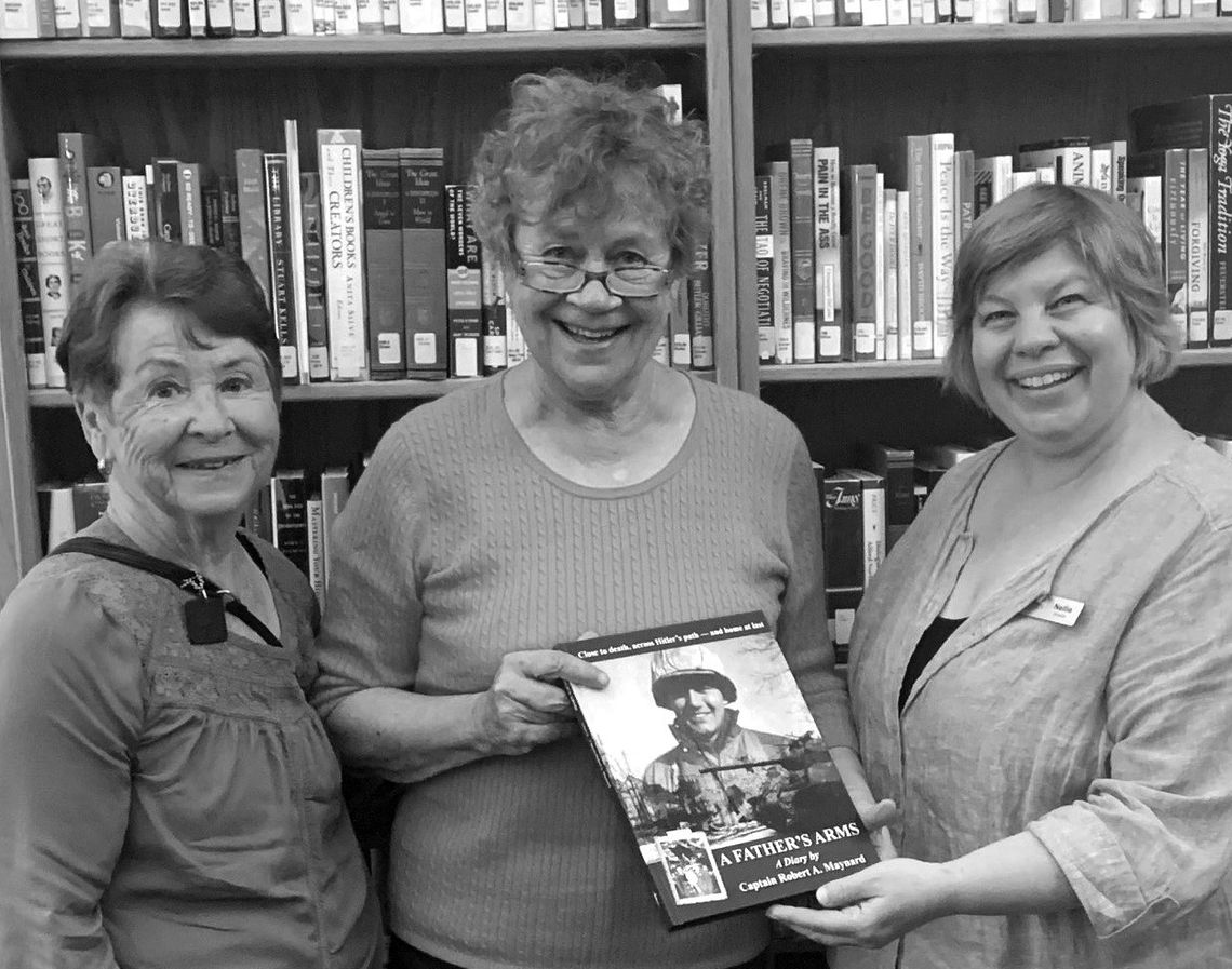 The P.E.O. Chapter EM of Suttons Bay recently presented a copy of the book ‘A Father’s Arms’ to Nellie Danke, librarian of the Suttons Bay-Bingham District Library. Author Mollie Moody compiled notes from her father’s experience in World War II which were published a book. The book was pre...
