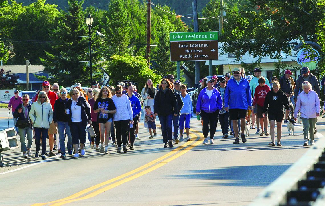 Nearly a hundred bridge walkers descended across the narrows bridge of Lake Leelanau to celebrate Labor Day Nearly a hundred bridge walkers descended across the narrows bridge of Lake Leelanau to celebrate Labor Day. The walkers started at Pedaling Beans before walking across the bridge to Boathouse Vineyards for an exhilarating duck race on Monday. Enterprise photo by Brian Freiberger