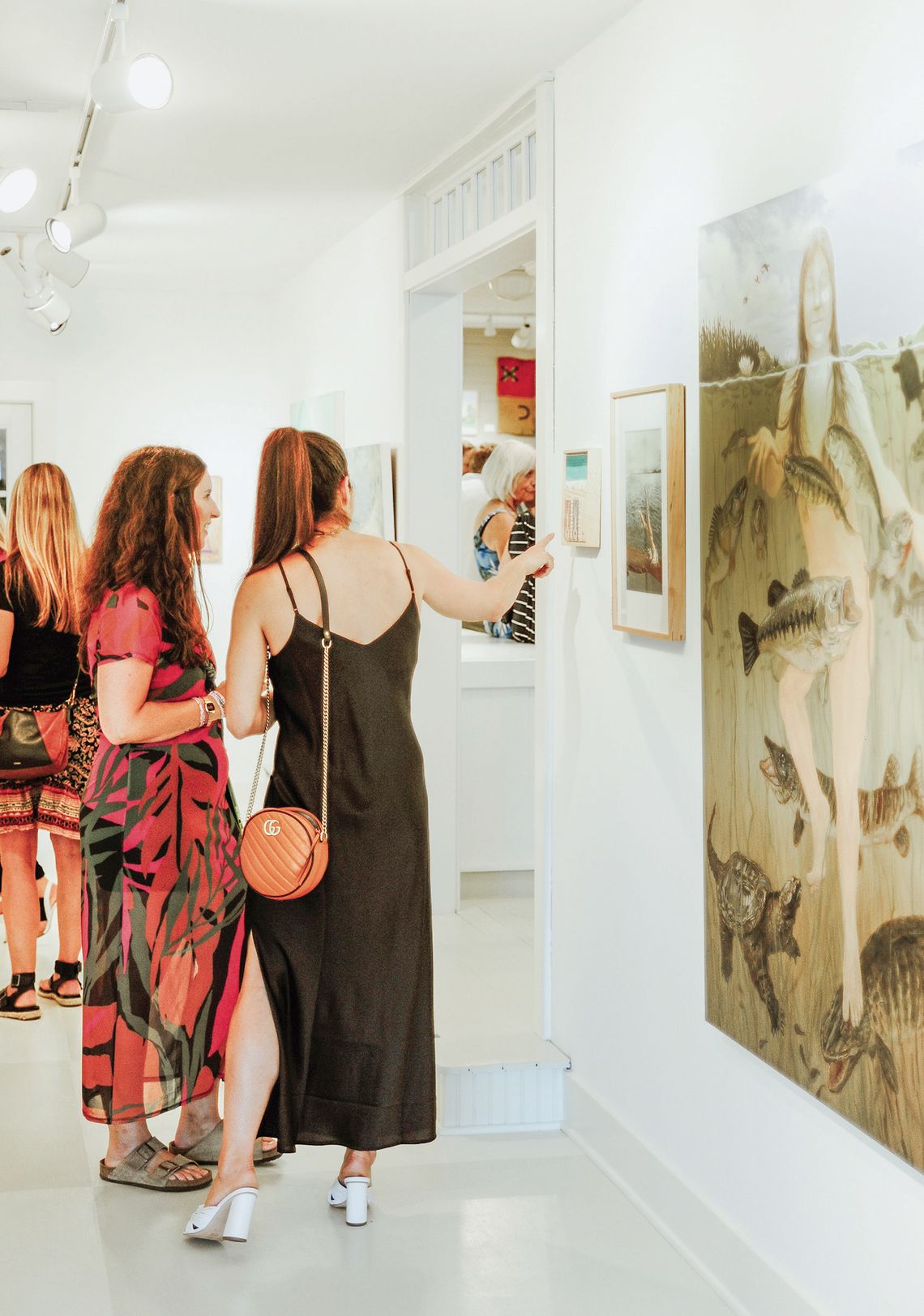 V Gallery in Omena held its first group exhibition, “Night of Nudes,” on Friday night. The artwork focused on night scenes and the nude form and was depicted through mediums like paintings, sculptures, photography, textile, and jewelry. Photo courtesy of Shannon Scott Photography