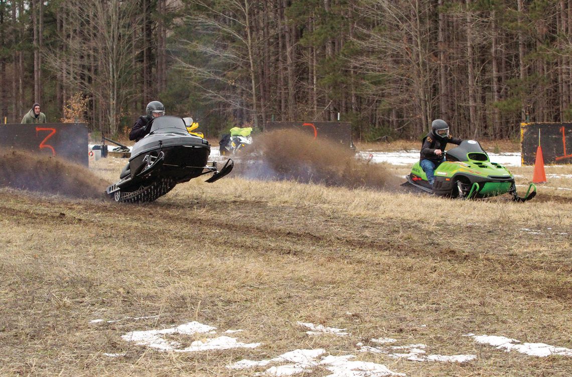 No snow, no problem! No snow, no problem! The Roy Taghon Empire Snowmobile Drag Race went off without snow as dozens of sled heads from around northern Michigan participated in the race that raises money for Glen Lake scholarships. Two racers dash off the starting line, spewing dirt and exhaust in front of spe...