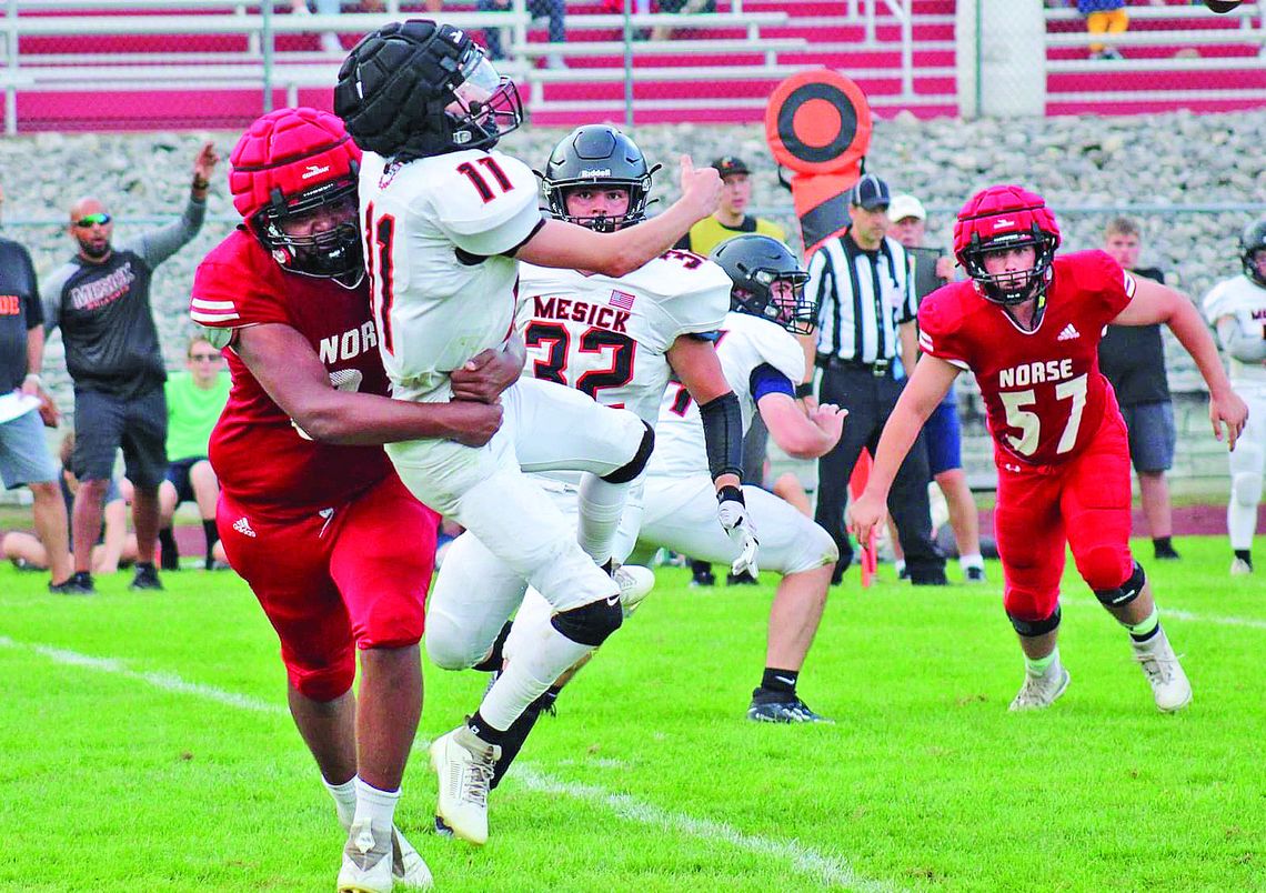 Suttons Bay defensive lineman Zachariah Raphael ran through the Mesick offensive line to pressure the quarterback during a win to start the season. Photos courtesy of Cynthia Opie