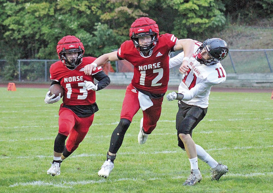 Suttons Bay senior quarterback Grayson Opie blocks for running back Jackson Loucks during a 33-16 win over Bear Lake on Friday. Photo courtesy of Cynthia Opie