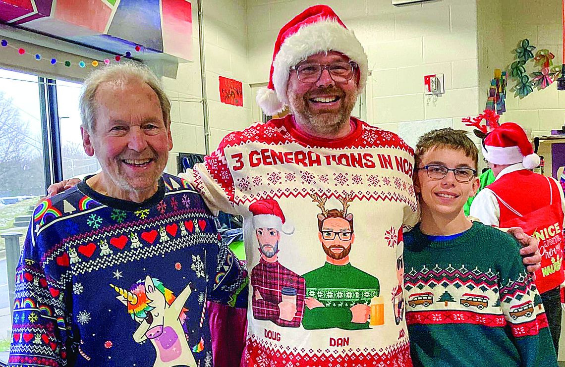 Three generations of the Scripps family, Doug, Dan and Jack (from left), all played in the Northport Community Band at last weekend’s Holiday Concert in Northport. Band members wore their favorite ugly holiday sweater. Photo courtesy of Lisa Drummond