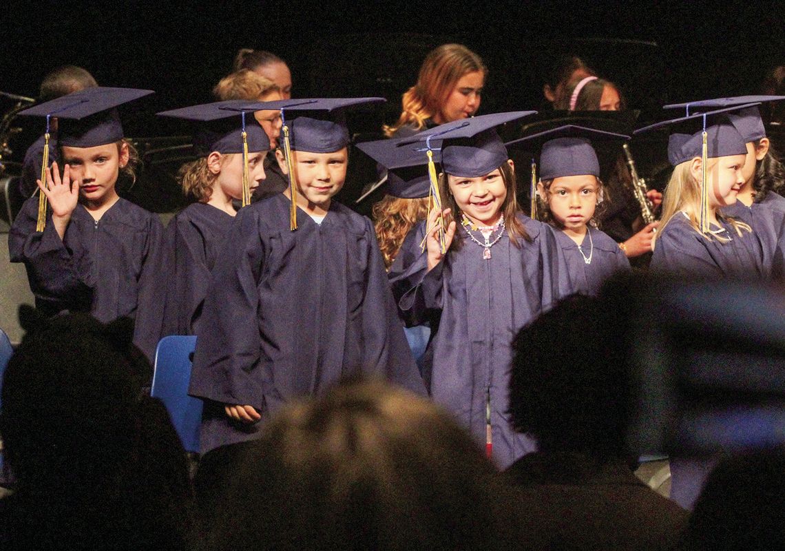 Northport kindergartners celebrate graduation by waving to families Friday