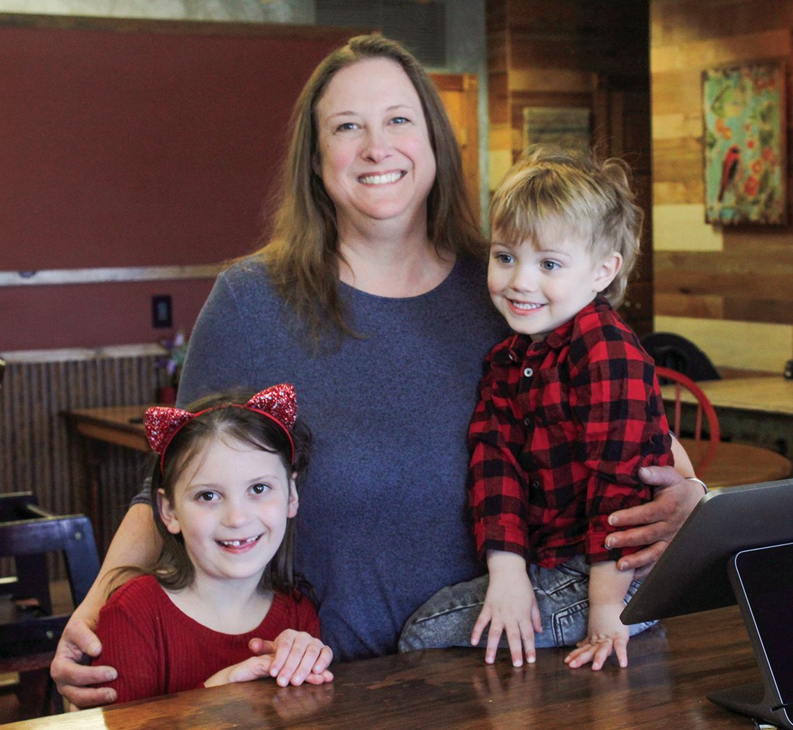 Cindy Henderson stands proudly with her grandchildren Lylah and Ollie after announcing the opening of Ollie R’s, a new burger joint in the same building that holds Lylah’s cafe. Enterprise photo by Brian Freiberger