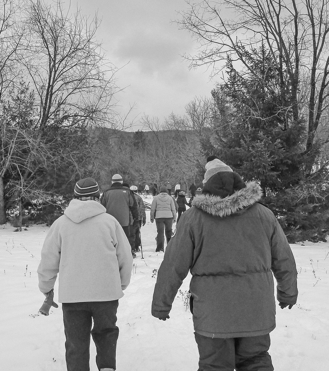 A group of visitors hiking through the snow with a park ranger at Sleeping Bear Dunes National Lakeshore. Photo courtesy of the National Park Service.