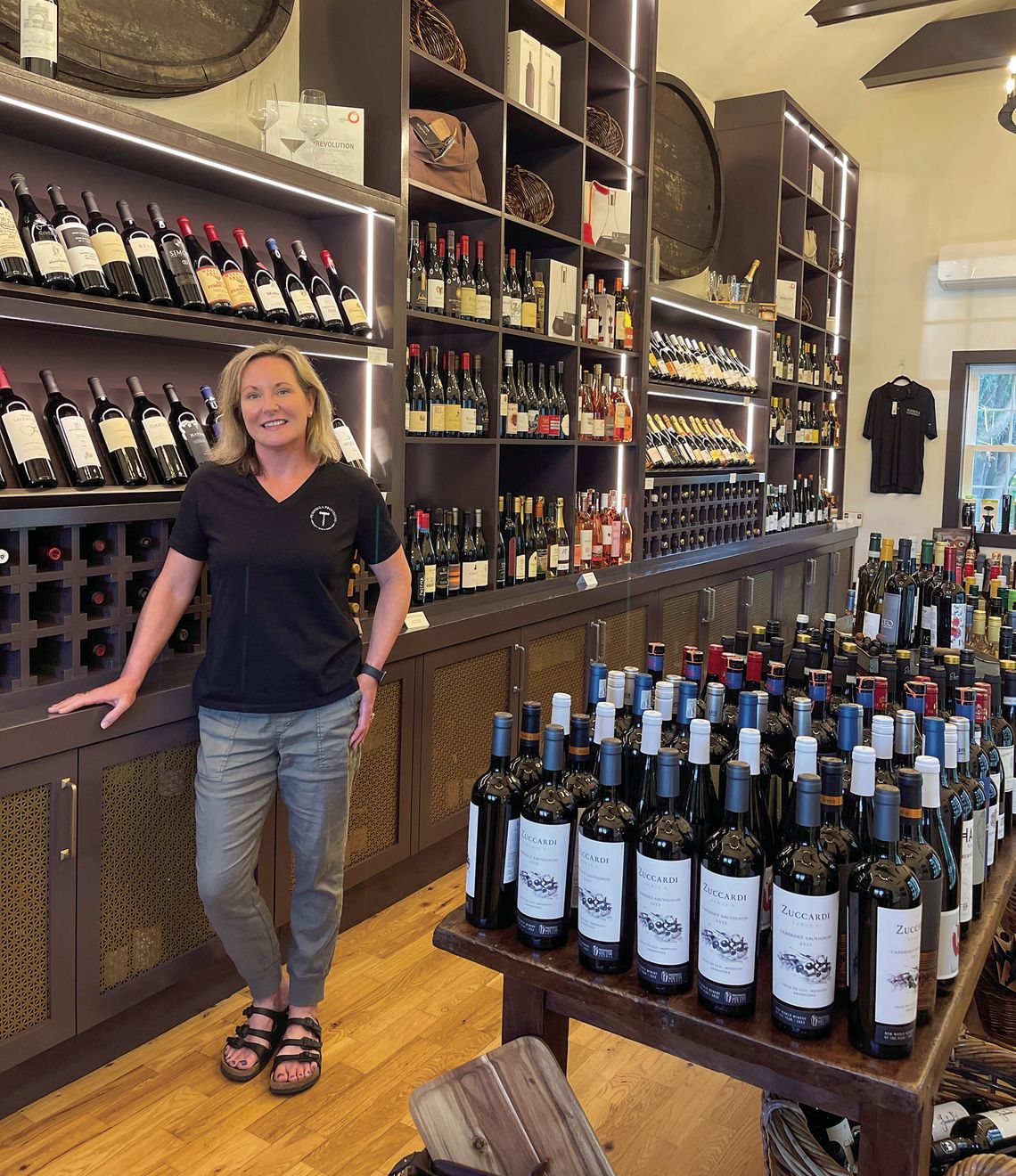 Peninsula Provisions Owner Kate Vilter Stassen is pictured next to the store’s diverse and specialty wine collection in Lake Leelanau. This week’s Diversion section is devoted to Leelanau Libations. Inside you’ll find: Enterprise photo by Meakalia Previch-Liu