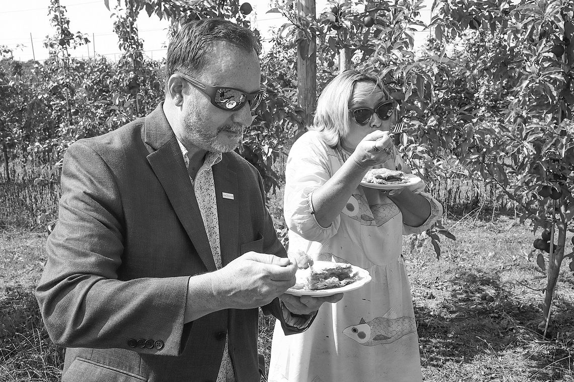 The Grand Traverse Pie Company unveiled its Pure Michigan Maple Glazed Apple Pie on Monday at the Northwest Horticultural Center in Bingham Township on Monday. Nikki Rothwell (right) and Pure Michigan Relations Director Nick Nerbonne test the new pie in a Leelanau County apple orchard. Ent...