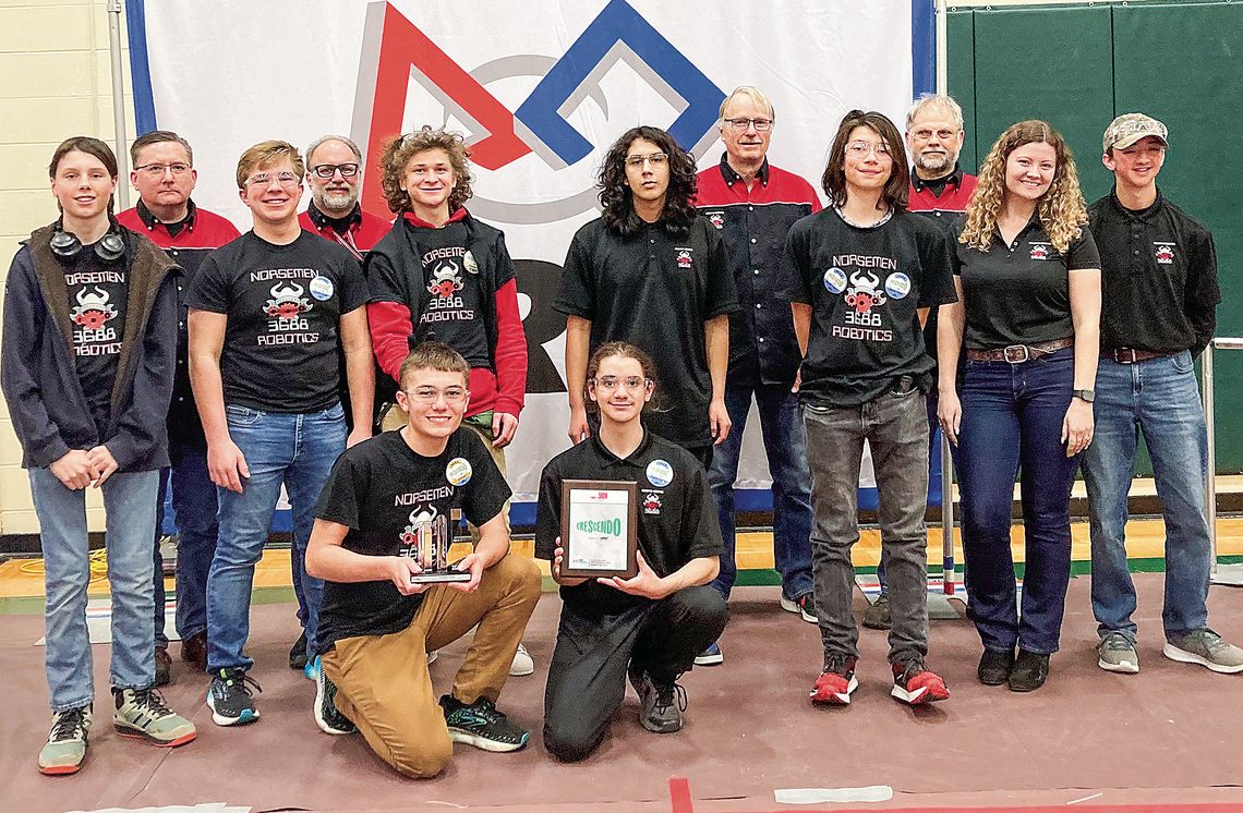 The Norsemen Robotics team poses after receiving the Quality Award at Traverse City West Senior High School. Front row from left to right: Team members Jacob Gulley and Casey Porter. Middle row left to right: Team members Koen Kruk, Anthony Grant, Jack Shiner, James Miller, Michael Rokita,...