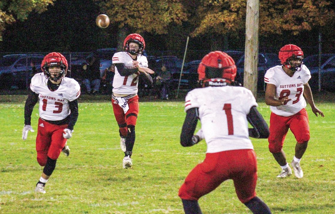 Suttons Bay senior quarterback Grayson Opie throws a dart to a wide receiver during a 43-0 win over Mesick Friday.