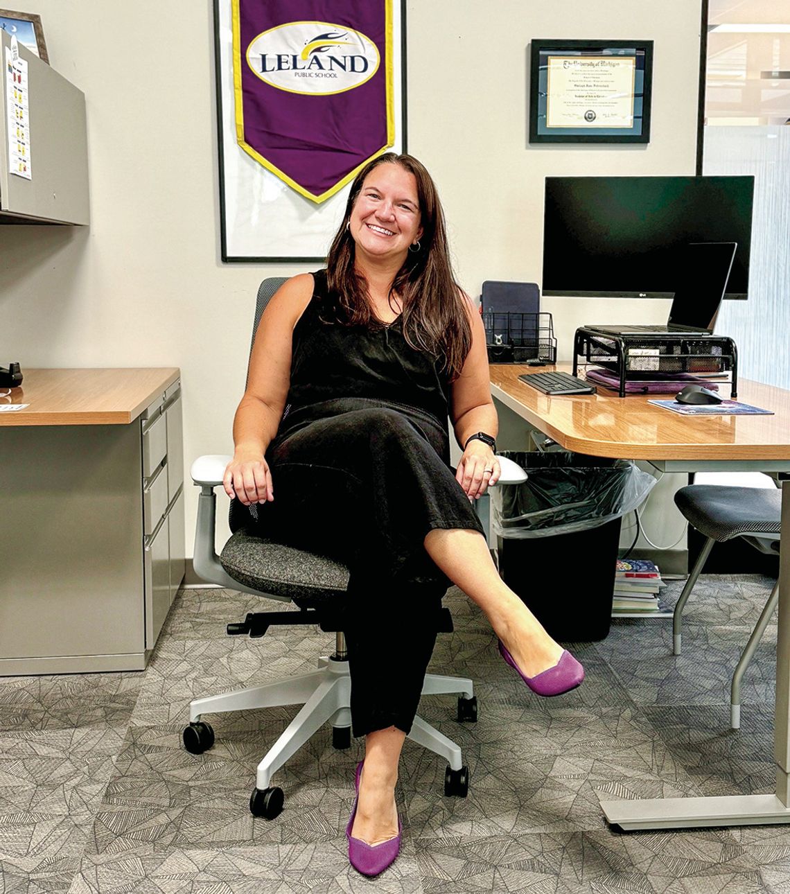 Shelagh Fehrenbach, pictured here in her new office, is not only a 2005 alumnus of Leland Public School, but will serve as the new K-12 principal for the district this year. Courtesy photo