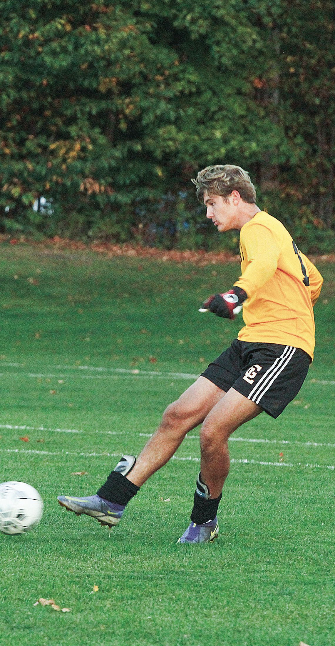 Glen Lake goalkeeper Anthony Forton clears the ball during a conference game earlier this month.