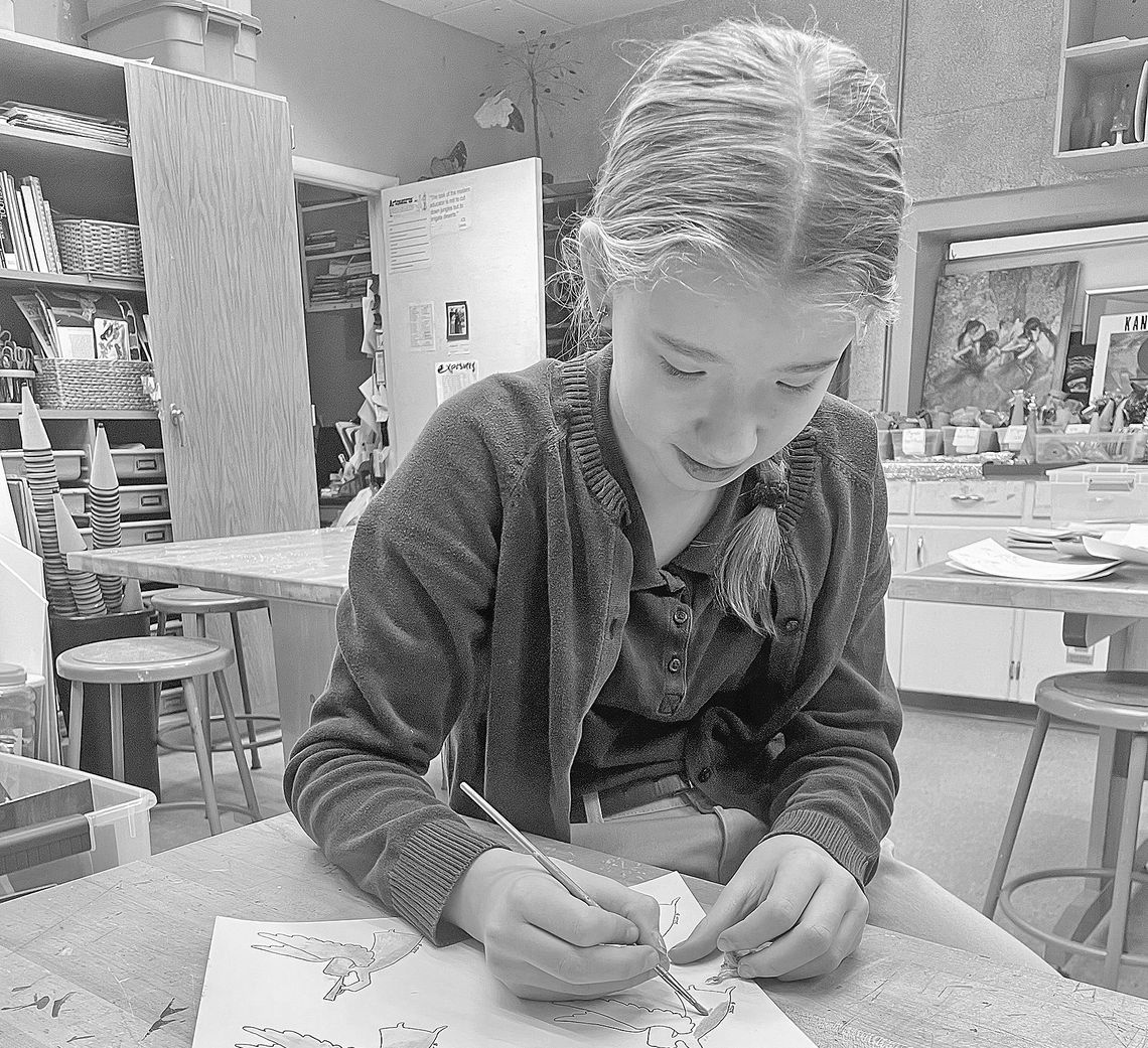 St. Mary School students created and mailed out Christmas cards to special friends including elderly community members, donors and local priests. Here, seventh grader Marie Hobbins paints Christmas cards for St. Mary School special friends. Courtesy photo
