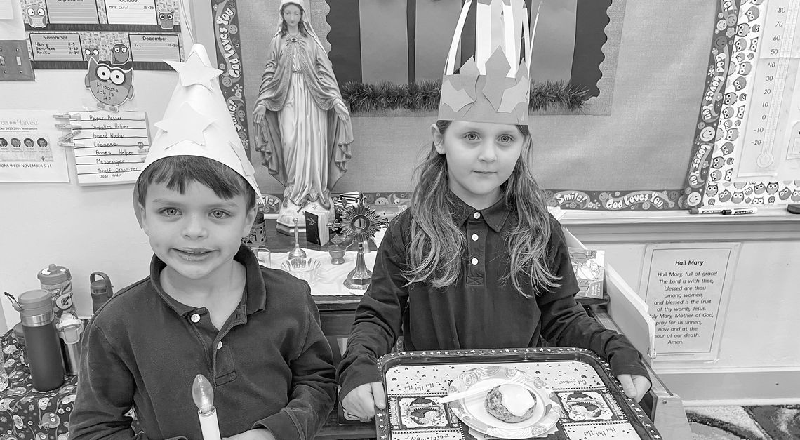 St. Mary second grade students St. Mary second grade students experienced the Feast Day of St. Lucy with a traditional Swedish St. Lucia celebration. They proclaimed “St. Lucia invites you to breakfast” as they dropped off a meal to teachers and staff. Joe Mullane and Amelia Gawrysiak prepare to deliver breakfast. Court...