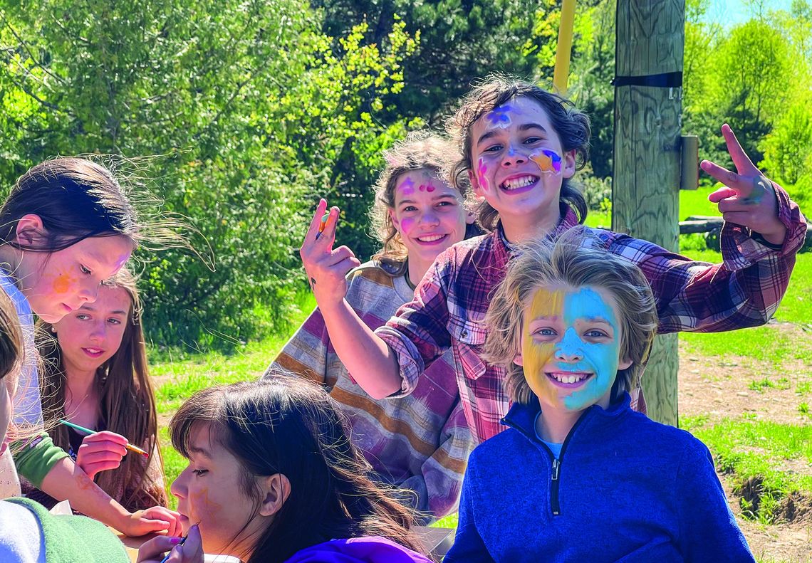 Students at Leelanau Montessori happily lined up for face painting outdoors at the school's annual Stone Soup event last Wednesday