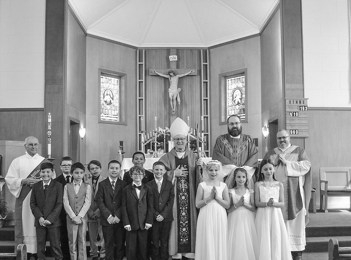 Students at St. Mary School Students at St. Mary School recently received the sacraments of First Communion and Confirmation. Sacraments are outward signs of inward grace, instituted by Christ. Presiding over the ceremony is Deacon Martin Korson, Bishop Jeffery Walsh, Father Ben Martin and Father Ben Rexroat. Courtes...