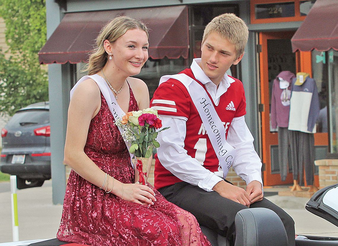 Suttons Bay senior Mya Kohler and Jackson Loucks ride in style during the 2024 Homecoming parade. Enterprise photos by Brian Freiberger
