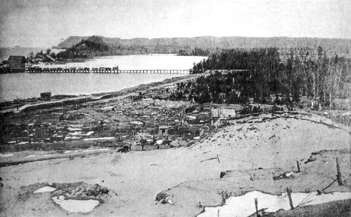 The Empire and Southeastern R.R. hauling logs across South Bar Lake to the North dock. Photo courtesy of the Empire Area Heritage Group