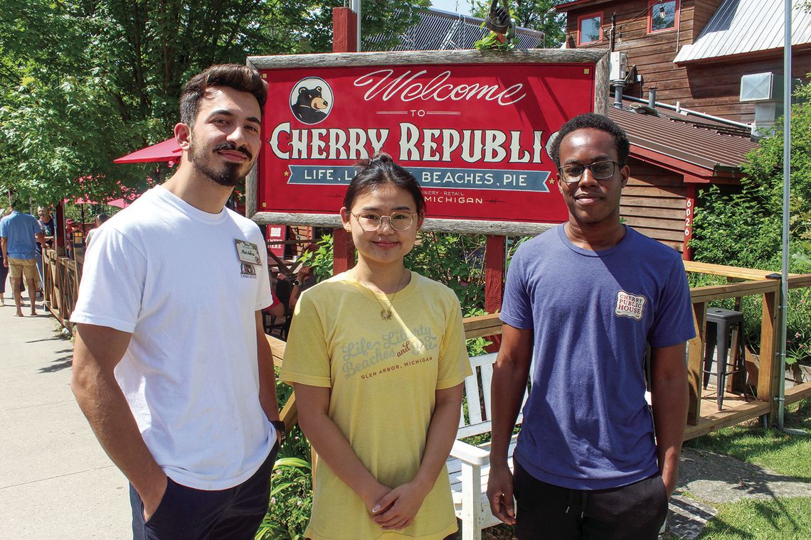 Several J1 visa and migrant workers help to make Cherry Republic function throughout summer and fall. From left to right: Mustafa Yesilay (Turkey), Freda Fan (China), and Kafhief Barnswell (Jamaica). Enterprise photo by Brian Freiberger