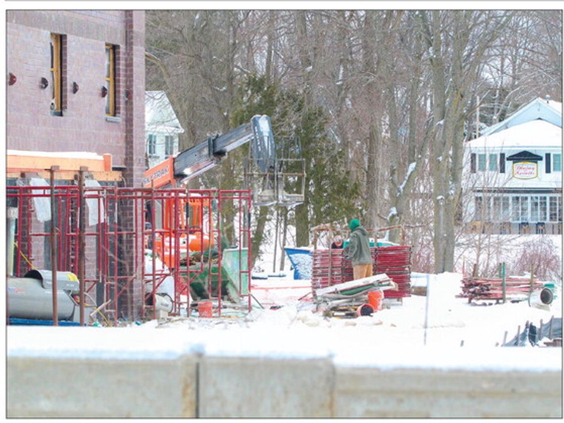 Workers brave the temperatures constructing the new Bluebird building in Leland Wednesday
